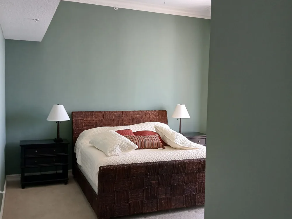 Bedroom painted a soft sage green